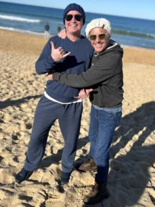 Paul Moore with his brother on the beach in Geelong, sharing laughs and memories of growing up together.