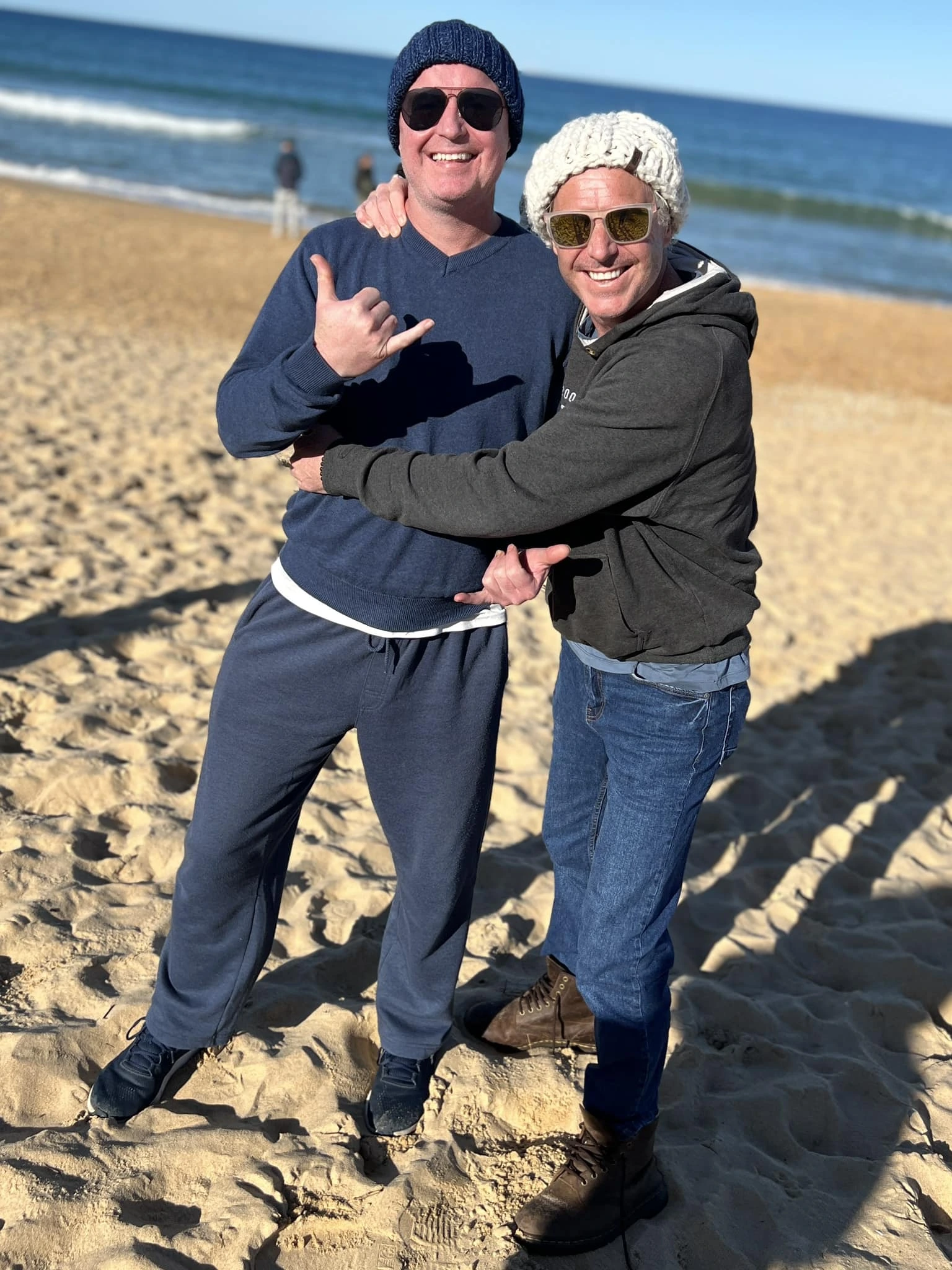 Paul Moore with his brother on the beach in Geelong, sharing laughs and memories of growing up together.