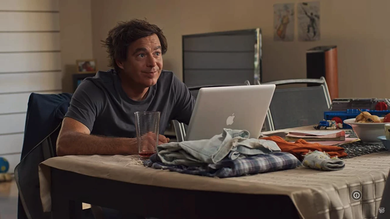 Paul Moore as Shaun from Rostered On, struggling with debt while working late on his photography business.