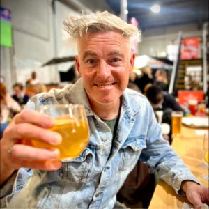 Paul Moore enjoying a craft beer at a Geelong brewery, reflecting on life balance and connection.