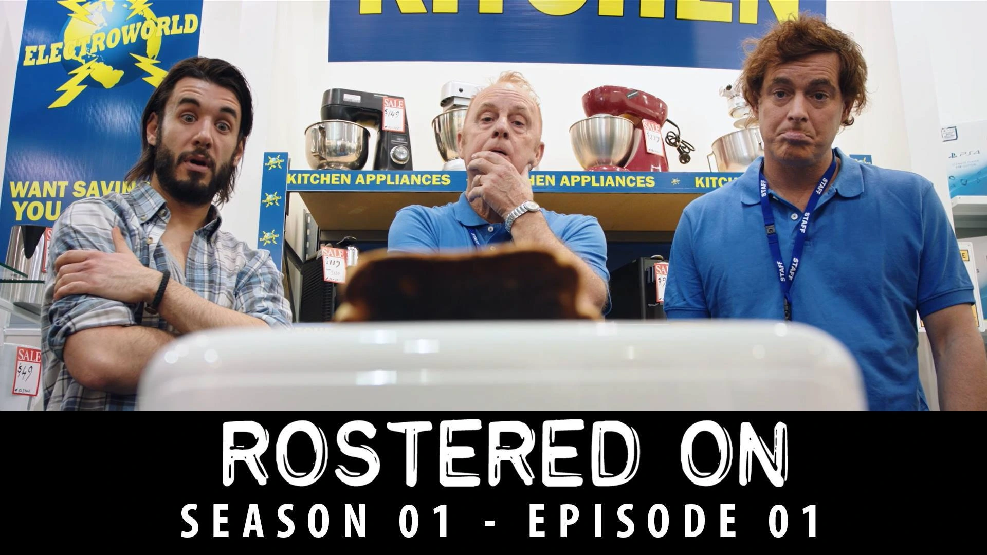 Paul Moore on set of Rostered On during the iconic toaster return scene, where a customer complains the toaster burns bread too well.