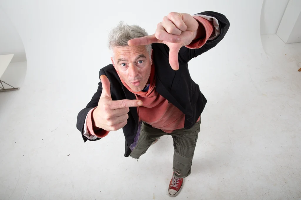 Paul Moore framing a shot during a studio photography session