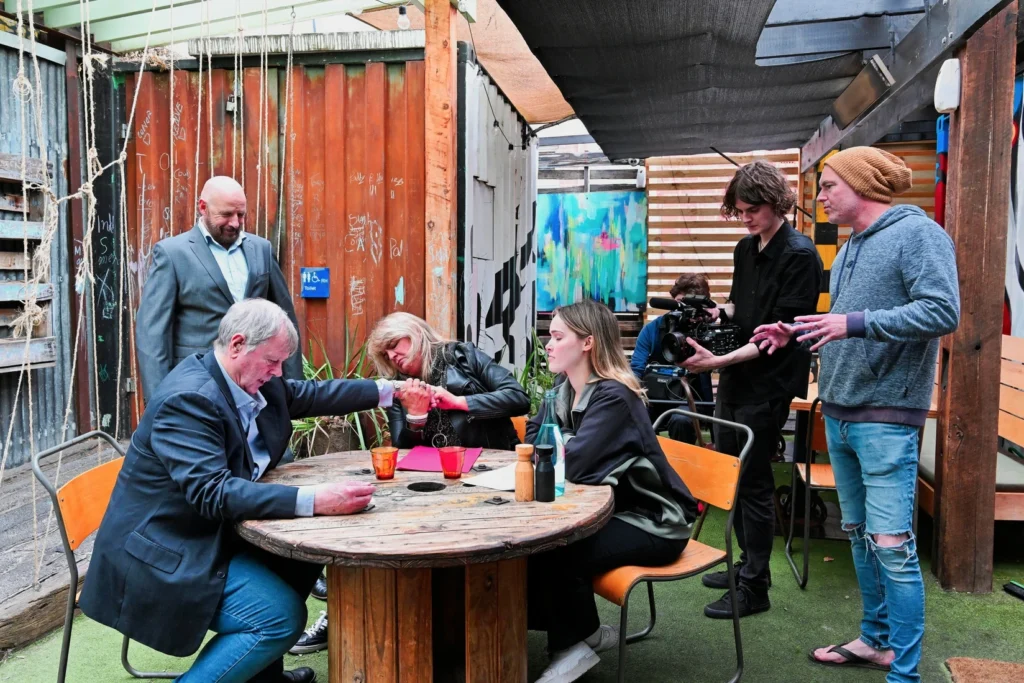 Paul Moore working with actors and a camera crew during a Geelong filming session