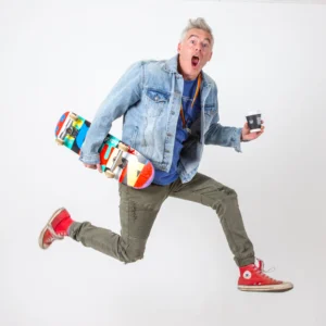 Paul Moore mid-jump during Stashamo High promotional photo shoot, combining energy and character.