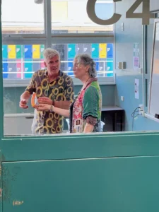 Paul Moore as Bates in Stashamo High shares an awkward exchange with a fellow teacher during the infamous sex-education class scene.