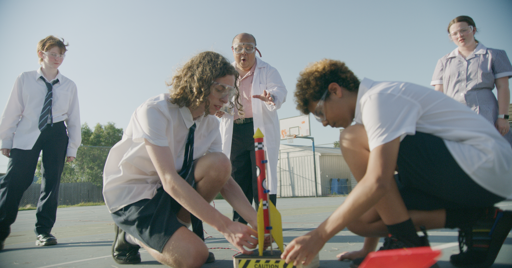 Students at Stashamo High launch homemade rockets during lunch, sparking chaos with the angry neighbour in this Geelong-filmed comedy scene.