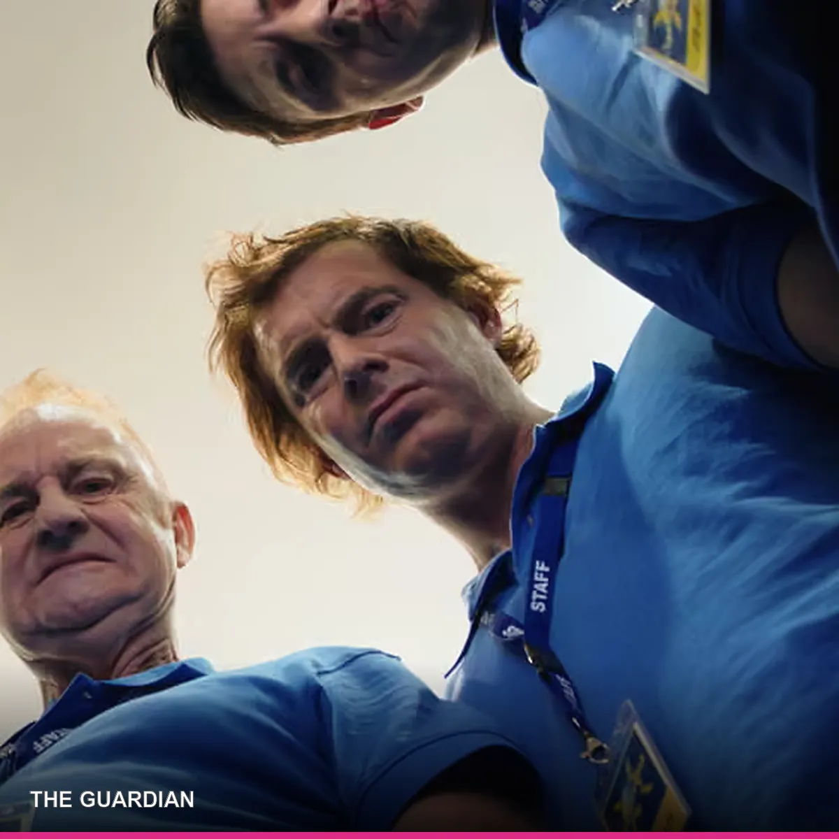 Paul Moore with the Rostered On cast in a low-angle promotional still
